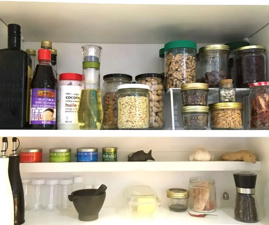 pantry shelves jars of oils, nuts, spices