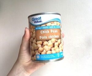 hand holding can of no added salt chickpeas