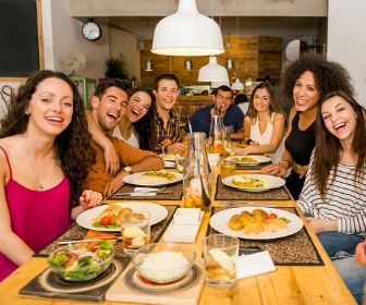 minimalist dinner party friends at table