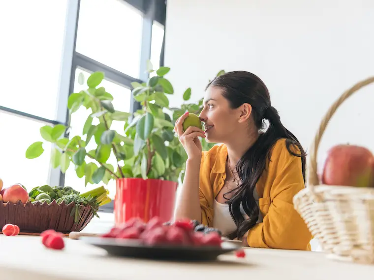 eat simply woman eating fruit