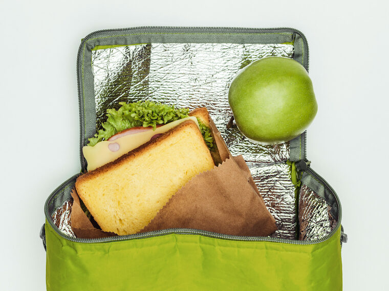 green lunch box, apple, sandwich