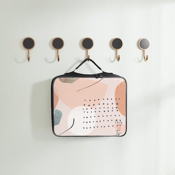 neutral abstract minimalist aesthetic lunch box hanging on row of hooks