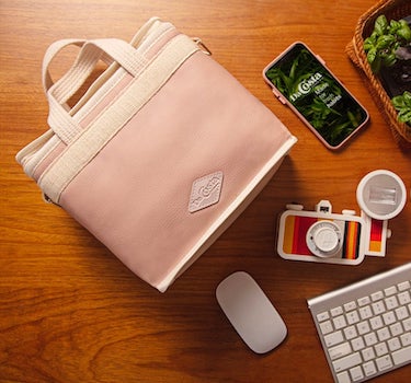 pink eco minimalist lunch box with phone, camera, keyboard flatlay