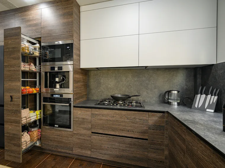 kitchen cabinets open to show kitchen organization tips. modern dark wood and white cabinets